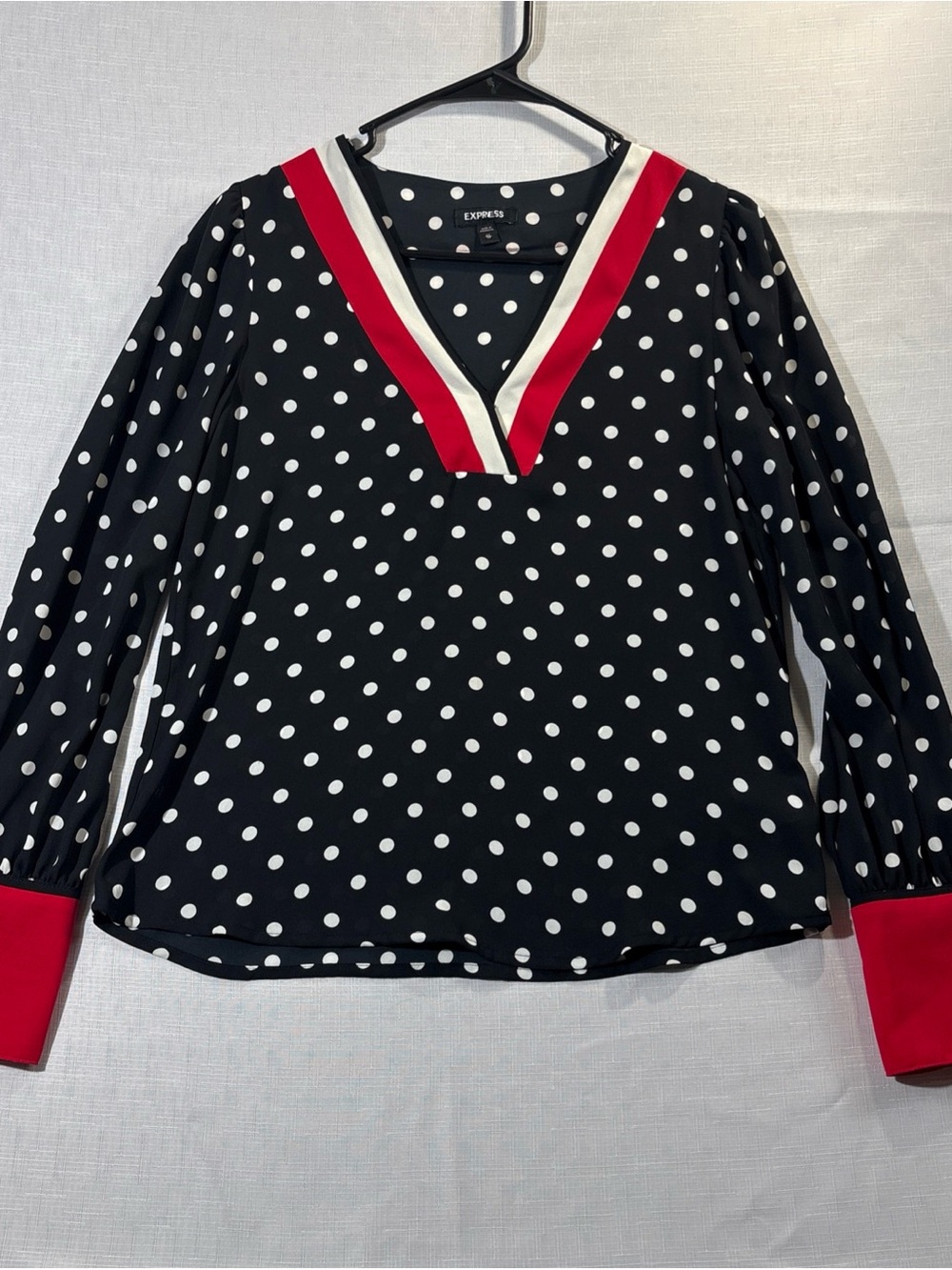 Express Black Polka Dot V-Neck Blouse with Red and Cream Trim